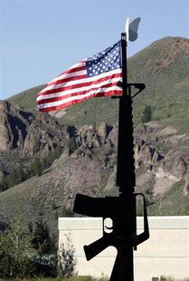 The U.S. flag flies atop a metal sculpture of an M-16 assault rifle outside Ketchum, Idaho July 7, 2009. REUTERS/Rick Wilking The U.S. flag flies atop a metal sculpture of an M-16 assault rifle outside Ketchum, Idaho July 7, 2009. REUTERS/Rick Wilking