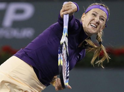 Victoria Azarenka of Belarus serves against Kirsten Flipkens of Belgium during their match at the BNP Paribas Open WTA tennis tournament in Victoria Azarenka of Belarus serves against Kirsten Flipkens of Belgium during their match at the BNP Paribas Open WTA tennis tournament in