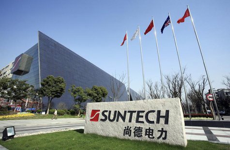 A man walks past Suntech Power Holdings headquarters in Wuxi, Jiangsu province March 26, 2010. REUTERS/Stringer A man walks past Suntech Power Holdings headquarters in Wuxi, Jiangsu province March 26, 2010. REUTERS/Stringer