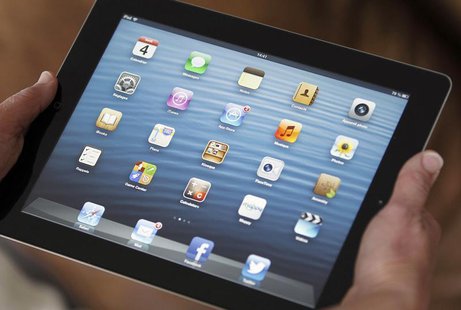 An illustration picture shows application icons on an Apple Ipad tablet held by a woman in Bordeaux, Southwestern France, February 4, 2013. An illustration picture shows application icons on an Apple Ipad tablet held by a woman in Bordeaux, Southwestern France, February 4, 2013.
