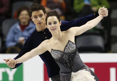 Ice dancers Tessa Virtue (R) and Scott Moir of Canada skate during practice sessions at the ISU World Figure Skating Championships in London Ice dancers Tessa Virtue (R) and Scott Moir of Canada skate during practice sessions at the ISU World Figure Skating Championships in London