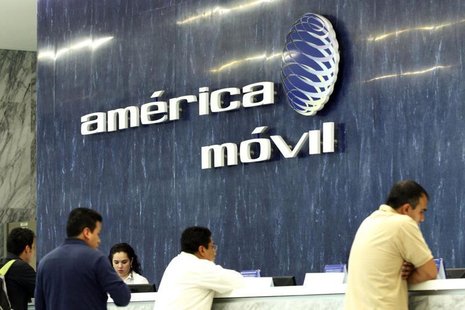 The logo of America Movil is seen on the wall of the reception area in the company's corporate offices in Mexico City February 13, 2013. REU The logo of America Movil is seen on the wall of the reception area in the company's corporate offices in Mexico City February 13, 2013. REU