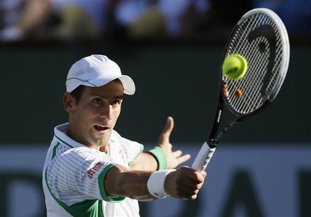 Novak Djokovic of Serbia returns a shot against Grigor Dimitrov of Bulgaria during their men's singles match at the BNP Paribas Open ATP ten Novak Djokovic of Serbia returns a shot against Grigor Dimitrov of Bulgaria during their men's singles match at the BNP Paribas Open ATP ten