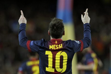 Barcelona's Lionel Messi celebrates after scoring his second goal against AC Milan during their Champions League round of 16 second leg socc Barcelona's Lionel Messi celebrates after scoring his second goal against AC Milan during their Champions League round of 16 second leg socc