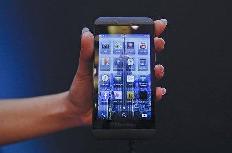 A BlackBerry salesperson displays a BlackBerry Z10 during the launch of the BlackBerry 10 smartphone in Mumbai February 25, 2013. REUTERS/Vi A BlackBerry salesperson displays a BlackBerry Z10 during the launch of the BlackBerry 10 smartphone in Mumbai February 25, 2013. REUTERS/Vi