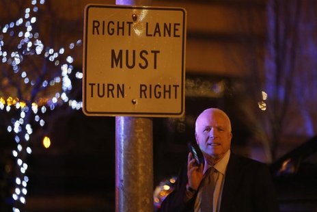 U.S. Senator John McCain (R-AZ) talks on his phone as he and other Republican senators depart after a private dinner with U.S. President Bar U.S. Senator John McCain (R-AZ) talks on his phone as he and other Republican senators depart after a private dinner with U.S. President Bar