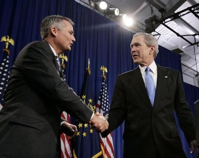 Former President George W. Bush (R) shakes hands with Republican Congressman Chris Chocola (R-IN) in Mishawaka, Indiana February 23, 2006. R Former President George W. Bush (R) shakes hands with Republican Congressman Chris Chocola (R-IN) in Mishawaka, Indiana February 23, 2006. R