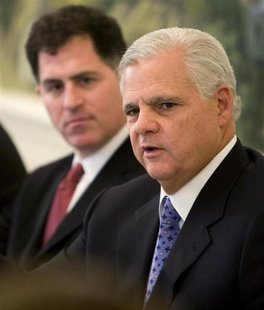 EMC Chief Executive Joe Tucci (R) speaks at a news briefing to release two reports addressing the impact of information technology on the en EMC Chief Executive Joe Tucci (R) speaks at a news briefing to release two reports addressing the impact of information technology on the en
