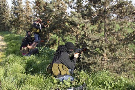 Members of a Syrian Shi'ite armed group known as "Popular Committees" pose with their weapons in Zayta February 26, 2013. REUTERS/Rami Bleib Members of a Syrian Shi'ite armed group known as "Popular Committees" pose with their weapons in Zayta February 26, 2013. REUTERS/Rami Bleib
