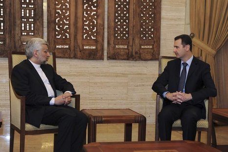 Syria's President Bashar al-Assad (R) meets Iran's Supreme National Security Council Secretary Saeed Jalili in Damascus February 3, 2013, in Syria's President Bashar al-Assad (R) meets Iran's Supreme National Security Council Secretary Saeed Jalili in Damascus February 3, 2013, in