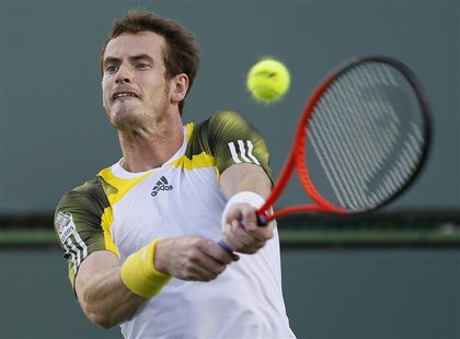 Andy Murray of Britain returns a shot against Carlos Berlocq of Argentina during their match at the BNP Paribas Open ATP tennis tournament i Andy Murray of Britain returns a shot against Carlos Berlocq of Argentina during their match at the BNP Paribas Open ATP tennis tournament i
