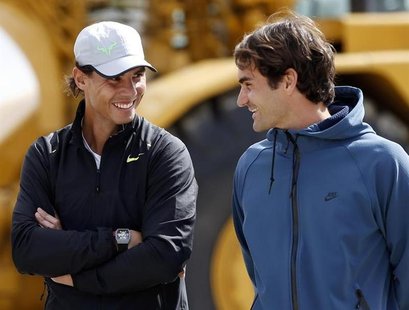 Rafael Nadal (L) of Spain and Roger Federer of Switzerland talk during a ground-breaking for the expansion of the Indian Wells Tennis Garden Rafael Nadal (L) of Spain and Roger Federer of Switzerland talk during a ground-breaking for the expansion of the Indian Wells Tennis Garden