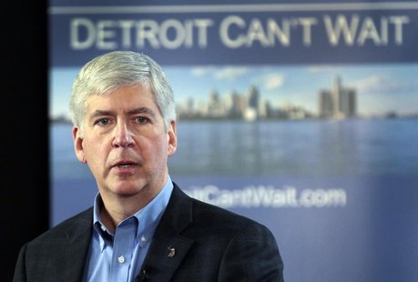 Michigan Governor Rick Snyder talks about the city of Detroit being in a financial emergency state during a meeting with an invited audience Michigan Governor Rick Snyder talks about the city of Detroit being in a financial emergency state during a meeting with an invited audience