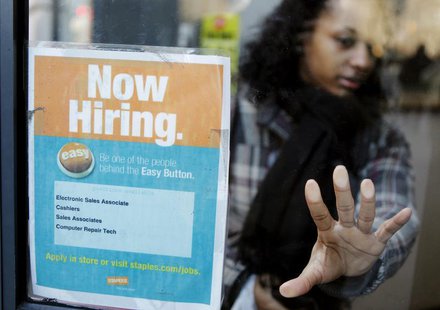 A woman opens a glass door with a "Now Hiring" sign on it as she enters a Staples store in New York March 3, 2011. REUTERS/Lucas Jackson A woman opens a glass door with a "Now Hiring" sign on it as she enters a Staples store in New York March 3, 2011. REUTERS/Lucas Jackson