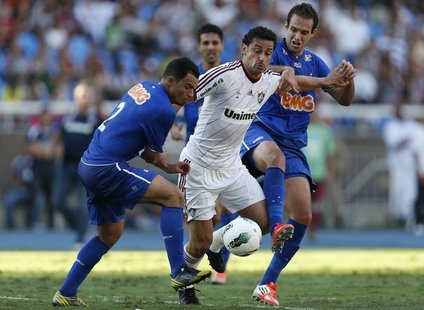 Fred of Fluminense (C) challenges Ceara (L) and Thiago Carvalho of Cruzeiro during a Brazilian Series A Championship match in Rio de Janeiro Fred of Fluminense (C) challenges Ceara (L) and Thiago Carvalho of Cruzeiro during a Brazilian Series A Championship match in Rio de Janeiro