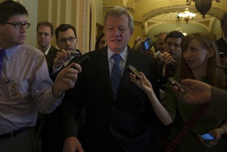 Sen. Max Baucus, (D-MT) is questioned by media at the U.S. Capitol in Washington December 31, 2012. REUTERS/Mary F. Calvert Sen. Max Baucus, (D-MT) is questioned by media at the U.S. Capitol in Washington December 31, 2012. REUTERS/Mary F. Calvert