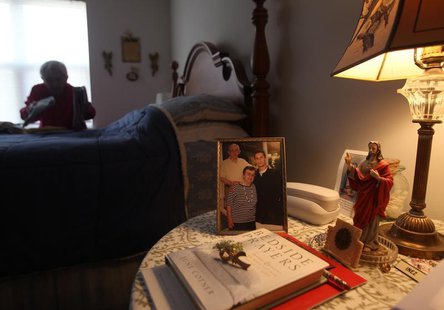 Inez Willis, a breast cancer survivor and a senior citizen, folds her laundry in the bedroom of her independent living apartment in Silver S Inez Willis, a breast cancer survivor and a senior citizen, folds her laundry in the bedroom of her independent living apartment in Silver S