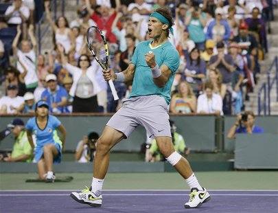 Rafael Nadal of Spain celebrates defeating Ernests Gulbis of Latvia during the third set of their men's singles match at the BNP Paribas Ope Rafael Nadal of Spain celebrates defeating Ernests Gulbis of Latvia during the third set of their men's singles match at the BNP Paribas Ope
