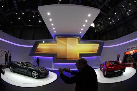 Visitors take pictures of Corvette cars on the Chevrolet booth during the second media day of the 83rd Geneva Car Show at the Palexpo Arena Visitors take pictures of Corvette cars on the Chevrolet booth during the second media day of the 83rd Geneva Car Show at the Palexpo Arena