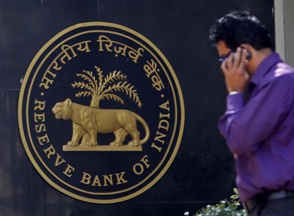 A man makes a phone call while standing near a Reserve Bank of India (RBI) crest at the RBI headquarters in Mumbai January 29, 2013. REUTERS A man makes a phone call while standing near a Reserve Bank of India (RBI) crest at the RBI headquarters in Mumbai January 29, 2013. REUTERS