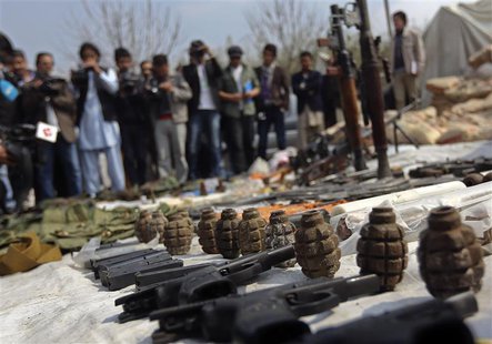 Weapons and ammunition seized from captured suspected Taliban are presented to the media at the National Directorate of Security (NDS) headq Weapons and ammunition seized from captured suspected Taliban are presented to the media at the National Directorate of Security (NDS) headq