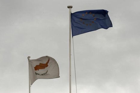 European Union (EU) and Cypriot flags flutter atop the Presidential palace in Nicosia February 22, 2013. REUTERS/Yorgos Karahalis European Union (EU) and Cypriot flags flutter atop the Presidential palace in Nicosia February 22, 2013. REUTERS/Yorgos Karahalis