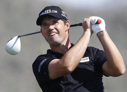 Irish golfer Padraig Harrington hits off the 2nd tee against Graeme McDowell during the weather delayed first round of the WGC-Accenture Mat Irish golfer Padraig Harrington hits off the 2nd tee against Graeme McDowell during the weather delayed first round of the WGC-Accenture Mat