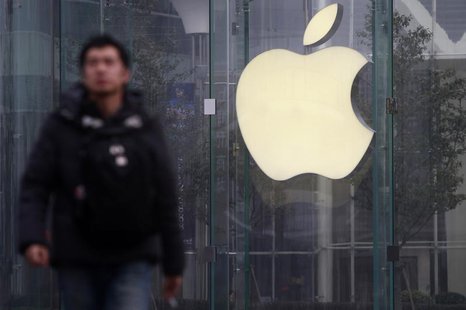 A man walks in front of a company logo outside an Apple store in downtown Shanghai January 24, 2013. REUTERS/Aly Song A man walks in front of a company logo outside an Apple store in downtown Shanghai January 24, 2013. REUTERS/Aly Song