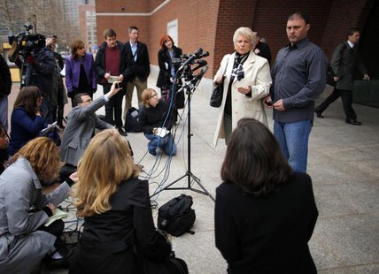 Patricia Donahue and her son Michael, wife and son of a suspected victim under James "Whitey" Bulger, talk to reporters outside the federal Patricia Donahue and her son Michael, wife and son of a suspected victim under James "Whitey" Bulger, talk to reporters outside the federal