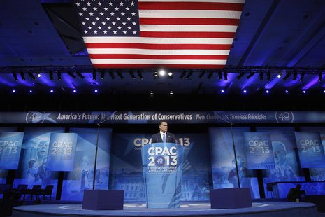 Former U.S. presidential candidate Mitt Romney stands onstage for remarks to the Conservative Political Action Conference (CPAC) in National Former U.S. presidential candidate Mitt Romney stands onstage for remarks to the Conservative Political Action Conference (CPAC) in National