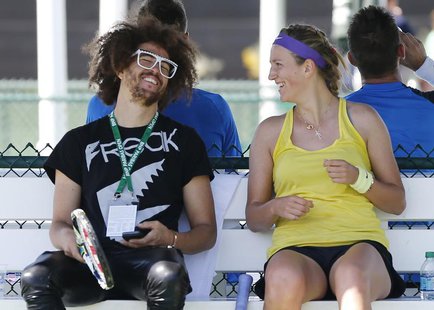 Victoria Azarenka of Belarus (R) laughs with her boyfriend singer Redfoo, also known as Stefan Gordy of the band LMFAO, during a practice se Victoria Azarenka of Belarus (R) laughs with her boyfriend singer Redfoo, also known as Stefan Gordy of the band LMFAO, during a practice se