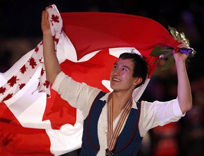 Patrick Chan of Canada carries his country's flag as he celebrates his gold medal finish after the presentation ceremony at the ISU World Fi Patrick Chan of Canada carries his country's flag as he celebrates his gold medal finish after the presentation ceremony at the ISU World Fi