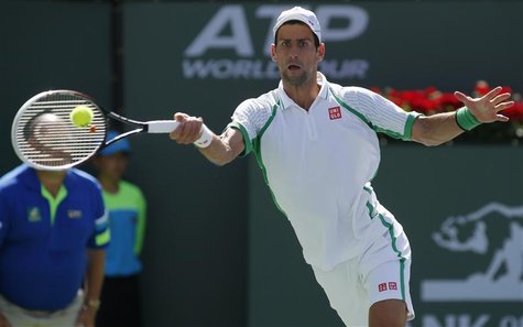 Novak Djokovic of Serbia returns a shot against Jo-Wilfried Tsonga of France during their men's singles quarterfinal match at the BNP Pariba Novak Djokovic of Serbia returns a shot against Jo-Wilfried Tsonga of France during their men's singles quarterfinal match at the BNP Pariba