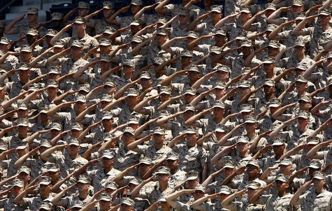 United States Marines salute from the stands during the American National Anthem prior to the start of the San Diego Padres vs the New York United States Marines salute from the stands during the American National Anthem prior to the start of the San Diego Padres vs the New York