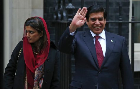 Pakistan's Prime Minister Raja Pervez Ashraf (R), waves as he leaves with Foreign Minister Hina Rabbani Khar, after their meeting with Brita Pakistan's Prime Minister Raja Pervez Ashraf (R), waves as he leaves with Foreign Minister Hina Rabbani Khar, after their meeting with Brita