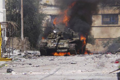 A burning tank is seen in Daraa March 9, 2013. Picture taken March 9, 2013. REUTERS/Ali Abu-Salah/Shaam News Network/Handout A burning tank is seen in Daraa March 9, 2013. Picture taken March 9, 2013. REUTERS/Ali Abu-Salah/Shaam News Network/Handout