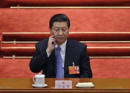 China's newly-elected President Xi Jinping scratches his face during the sixth plenary meeting of the National People's Congress (NPC) at th China's newly-elected President Xi Jinping scratches his face during the sixth plenary meeting of the National People's Congress (NPC) at th