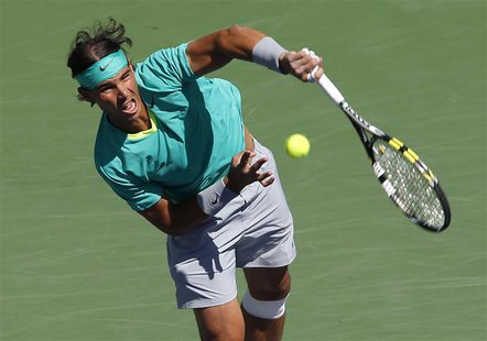 Rafael Nadal of Spain returns a volley at the net against Tomas Berdych of the Czech Republic during their men's singles semifinal match at Rafael Nadal of Spain returns a volley at the net against Tomas Berdych of the Czech Republic during their men's singles semifinal match at