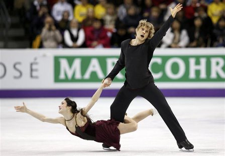 Meryl Davis and Charlie White of the U.S. perform their ice dance free dance at the ISU World Figure Skating Championships in London, Ontari Meryl Davis and Charlie White of the U.S. perform their ice dance free dance at the ISU World Figure Skating Championships in London, Ontari