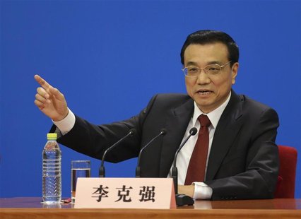 China's newly-elected Premier Li Keqiang gestures as he answers questions during a news conference after the closing session of the National China's newly-elected Premier Li Keqiang gestures as he answers questions during a news conference after the closing session of the National