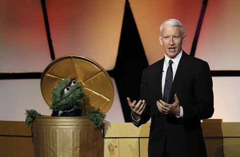 Television host Anderson Cooper and Oscar the Grouch, a character from Sesame Street, open the 39th Daytime Emmy Awards in Beverly Hills, Ca Television host Anderson Cooper and Oscar the Grouch, a character from Sesame Street, open the 39th Daytime Emmy Awards in Beverly Hills, Ca