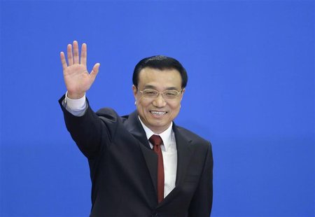 China's newly elected Premier Li Keqiang waves as he leaves a news conference after the closing session of the National People's Congress (N China's newly elected Premier Li Keqiang waves as he leaves a news conference after the closing session of the National People's Congress (N