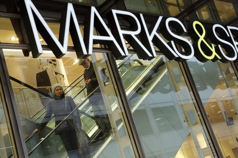 A couple shop at a branch of British retail chain Marks & Spencer in the financial district City of London January 11, 2013. REUTERS/Chris H A couple shop at a branch of British retail chain Marks & Spencer in the financial district City of London January 11, 2013. REUTERS/Chris H
