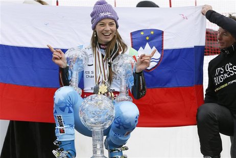 Slovenia's Tina Maze poses with her women's overall, Giant Slalom and Super-G World Cup trophies at the Alpine Skiing World Cup finals in Le Slovenia's Tina Maze poses with her women's overall, Giant Slalom and Super-G World Cup trophies at the Alpine Skiing World Cup finals in Le