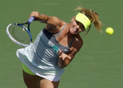 Maria Sharapova of Russia serves to Caroline Wozniacki of Denmark during their women's singles final match at the BNP Paribas Open WTA tenni Maria Sharapova of Russia serves to Caroline Wozniacki of Denmark during their women's singles final match at the BNP Paribas Open WTA tenni
