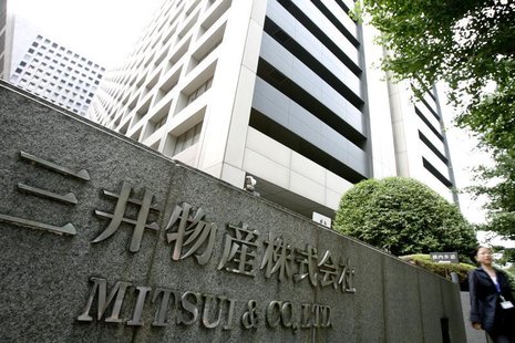 A woman walks past the headquarters of Japanese general trading company Mitsui & Co., Ltd. in Tokyo July 9, 2009. REUTERS/Stringer A woman walks past the headquarters of Japanese general trading company Mitsui & Co., Ltd. in Tokyo July 9, 2009. REUTERS/Stringer