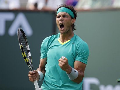 Rafael Nadal of Spain celebrates breaking the serve of Juan Martin Del Potro of Argentina during their men's singles final match at the BNP Rafael Nadal of Spain celebrates breaking the serve of Juan Martin Del Potro of Argentina during their men's singles final match at the BNP