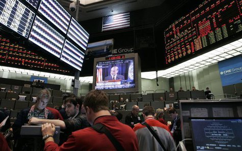 Traders at the CME Group watch a television broadcast of Federal Reserve Chairman Ben Bernanke as he answers questions during a first-ever n Traders at the CME Group watch a television broadcast of Federal Reserve Chairman Ben Bernanke as he answers questions during a first-ever n