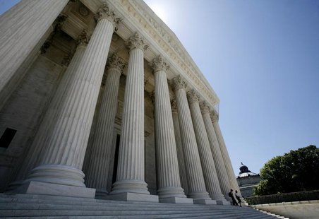 People walk down the steps of the Supreme Court in Washington May 20, 2009. REUTERS/Molly Riley People walk down the steps of the Supreme Court in Washington May 20, 2009. REUTERS/Molly Riley