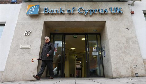 A customer walks out of a branch of Bank of Cyprus UK, in north London March 18, 2013. REUTERS/Andrew Winning A customer walks out of a branch of Bank of Cyprus UK, in north London March 18, 2013. REUTERS/Andrew Winning